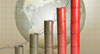 oil barrels stacked showing incline with graph and globe in background